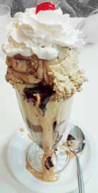 black and tan sundae, chocolate and toasted almond ice cream with fudge and caramel sauces