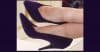 KK's purple suede stilettos mean business. And bunions.