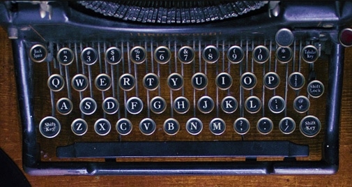 old-fashioned typewriter on wood desk