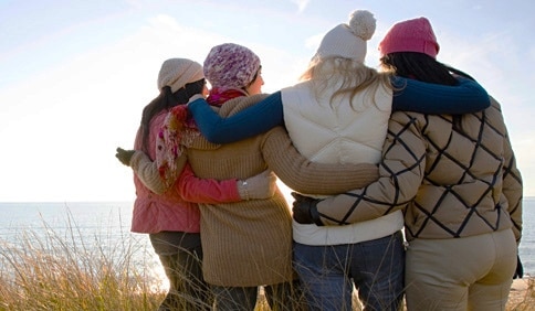women hugging in friendship