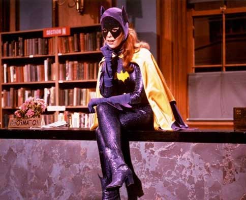 Batgirl from 1966 series sits on library desk