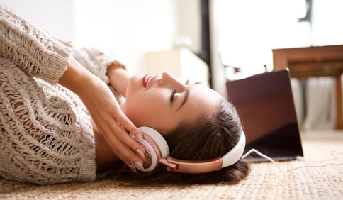 woman listening to headphones